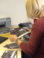 Debbie going through all reply cards that have been returned to us from the guilds