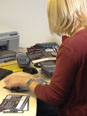 Debbie going through all reply cards that have been returned to us from the guilds